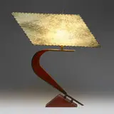 Table lamp by Modern, c. 1955, carved wood, bronze, painted and textured vellum with leather stitching, sold Nov 2023