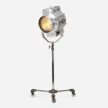 attribution Mole-Richardson, Adjustable studio floor lamp, c. 1935, chrome-plated and patinated stainless steel, fresnel lens