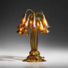 Tiffany Studios, Twelve-light Lily table lamp, c. 1910, acid-etched and gilt bronze, hand-blown Favrile glass