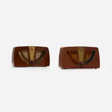 radios model 6D030, pair by Charles and Ray Eames, 1946, walnut plywood, brass, upholstery, Bakelite, sold Mar 2018