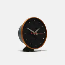 Masonite table clock, model 4767A by George Nelson & Associates, 1949, masonite, enameled aluminum, lacquered wood, enameled steel, walnut, map pins, sold Mar 2018