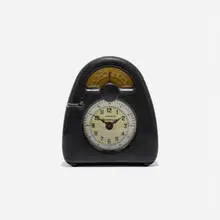 Measured Time clock and kitchen timer by Isamu Noguchi, c. 1932, Bakelite, glass, printed paper, sold Mar 2018