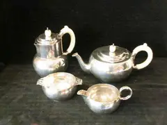 Glasgow Alexander Scott, An Art Deco siver and ivory four piece tea set,