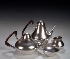 Henning Kopel, A Lavorazone white metal four piece tea set,, of tapering form with rosewood handles, comprising