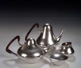 Henning Kopel, A Lavorazone white metal four piece tea set,, of tapering form with rosewood handles, comprising