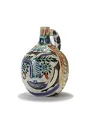 Laughing-eyed face by Pablo Picasso, 1969, Turned pitcher of white earthenware clay, decoration in engobes engraved by knife under partial brushed glaze, black pat, sold May 2017