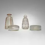 Collection of perfume bottles and boxes by René Lalique, c. 1919-1926, frosted, tinted and clear glass, sold Oct 2023