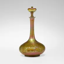 Decanter with grapevine by Tiffany Studios, c. 1915, hand-blown and wheel-carved Favrile glass, sold Oct 2023