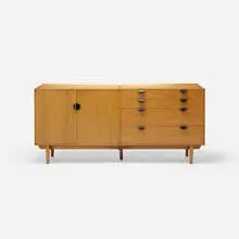 cabinet by Finn Juhl, c. 1951, walnut, enameled brass, sold Jan 2018
