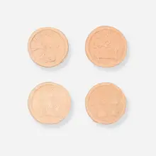 George E. Ohr, Collection of four brothel tokens, c. 1900, bisque earthenware