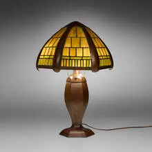 George H. Trautmann, Lamp shade on associated base, handwrought copper, slag glass