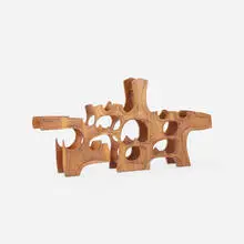 Federico Armijo, sculptural wine rack, c. 1975, carved walnut