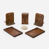 Collection of six table articles by Handicraft Shop and Marblehead Pottery, c. 1904-08, 1931, embroidered fabric over steel. copper, metal, walnut, earthenware, sold Mar 2026