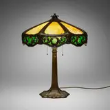 George H. Trautmann, Table lamp with foliate motifs, c. 1910, handwrought copper, slag glass