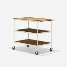 Custom tea cart by Richard Schultz, c. 1958, enameled steel, laminated maple, birch plywood, rubber, sold Sep 2017