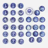 Royal Copenhagen, Collection of thirty-two wall-hanging plates, glazed porcelain