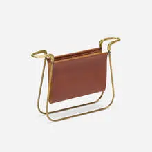 magazine stand, model 3805 by Carl Auböck, c. 1950, brass, leather, sold Jul 2017