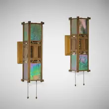 Frank Lloyd Wright, Sconces from the first Francis W. Little House, Peoria, Illinois, pair, c. 1902, brass-plated bronze, iridized opalescent glass