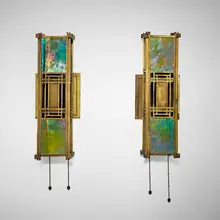 Frank Lloyd Wright, Sconces from the first Francis W. Little House, Peoria, Illinois, pair, c. 1902, brass-plated bronze, iridized opalescent glass