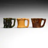 George E. Ohr, Collection of three puzzle mugs, glazed earthenware