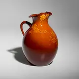 Dark Standard Glaze pitcher with flowers by Matthew Daly for Rookwood Pottery, sold Jun 2025