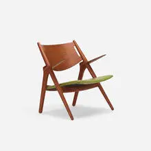 Sawbuck chair by Hans J. Wegner, 1951, stained oak, upholstery, sold Jul 2017
