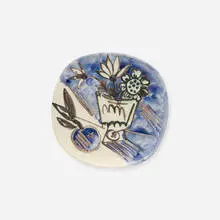 Bunch with Apple plate by Pablo Picasso, 1956, white earthenware clay, decoration accentuated with oxidized paraffin, oxides under glaze, sold Jul 2017