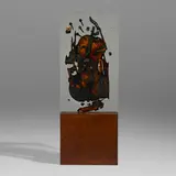 Arman, Untitled, 1979, burnt and broken cello embedded in polyester resin, stained ply-wood base