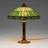 Table lamp by Suess Ornamental Glass Company, c. 1910, leaded glass, Verde Green-patinated bell bronze, sold Mar 2025