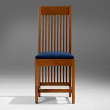 Spindle chair from the living room of the Avery Coonley House, Riverside, Illinois by Frank Lloyd Wright and George Mann Niedecken, c. 1908, oak, microfiber upholstery, sold Mar 2025
