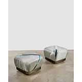 Karl Springer, Pair of 'Souffle' Ottomans, , polished steel with gunmetal finish, fabric