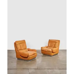 Pair of Lounge Chairs by Guido Faleschini, for Mariani, leather, chrome-plated steel, partial paper label on one, sold Mar 2026