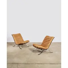 Arne Norell, Pair of 'Ari' Lounge Chairs, for Norell, leather and chrome-plated steel, decal manufacturer's label 'NORELL Made in Sweden'