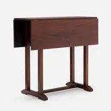 Rare shoefoot drop-leaf table by Gustav Stickley, c. 1915, mahogany, sold Oct 2024
