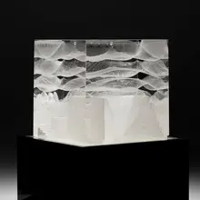 Cube by Steven Weinberg, c. 2010, cast and polished optical crystal with controlled air bubbles, sold Mar 2023