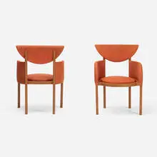 pair of armchairs from the Riverview Terrace Restaurant, Spring Green by Frank Lloyd Wright, 1953, stained oak, upholstery, sold Apr 2017
