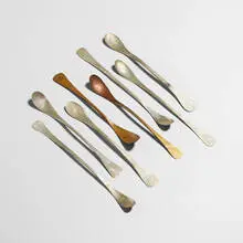 John Prip, spoon studies, set of eight, c. 1960, hand-hammered and forged sterling silver, brass