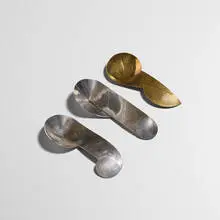 John Prip, Overlap spoon studies, set of three, c. 1976, sterling silver, brass