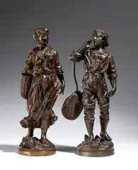 Victor Rousseau, Pair of French bronze sculptures, signed by Rousseau, depicting a young couple of fishermen. Both works are finely chiseled and rest on an integrated circular base.