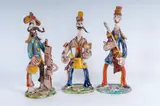 Giovanni De Simone, Lot of three stylised military figures in polychrome ceramic:, two with rifles