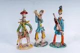 Giovanni De Simone, Lot of three stylised military figures in polychrome ceramic:, a rifleman