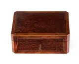 French Napoleon III jewellery box by Tahan À Paris. Jean-Pierre Alexandre Tahan, veneered in tuja burl and edged in purple ebony and rosewood with brass fillets. Signed Tahan Paris lock., offered Dec 2025