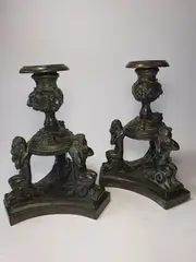 Pair of candlesticks with satyrs by Niccolò Roccatagliata, Dark brown-green patina bronze, offered Jul 2025