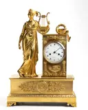 Pierre-François Feuchère, French Empire bronze mantel clock, Mercury-gilded bronze case resting on four leafed feet