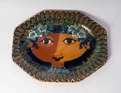 Girl by Bjørn Wiinblad, polychrome ceramic plate of octagonal shape with geometric decoration on the rim and a stylised face on the bottom., offered Mar 2025