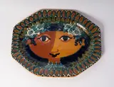 Bjørn Wiinblad, Girl, polychrome ceramic plate of octagonal shape with geometric decoration on the rim and a stylised face on the bottom.