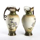 Turn Ernst Wahliss, A pair of Austrian ceramic pourers, Enameled and painted with floral motifs. The underside with red factory mark of Ernst Wahliss Turn Vienna and
