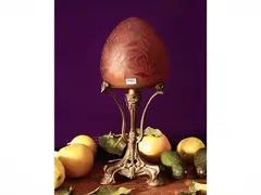Double Cammeo glass lamp by Émile Gallé, Golden bronze foot and double glass hat on the tones of the red with decoration of flowers and leaves. Signed, offered Jun 2026