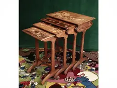 Four nest tables by Émile Gallé, Plans inlaid with floral subjects and animals of various woods gathered by carved crossings. Signed on the table, offered Jun 2026