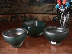 Pair of small bowls, Corrosi series, Venini 1936 by Carlo Scarpa, in submerged green glass with an entirely worked surface with acid, offered Jul 2025